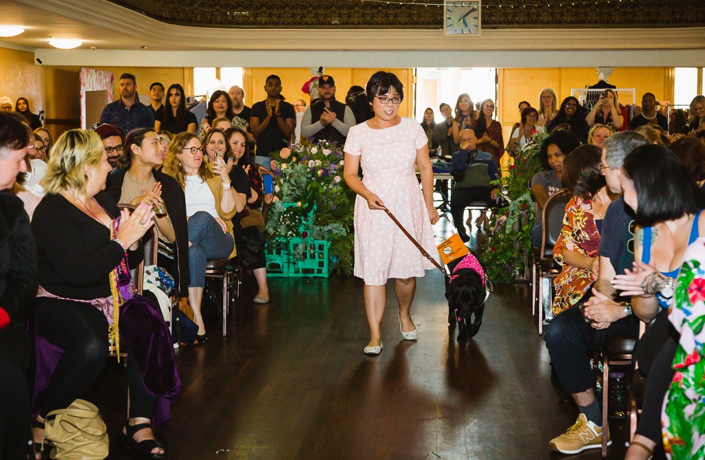Peggy Soo with her dog guide on the catwalk.