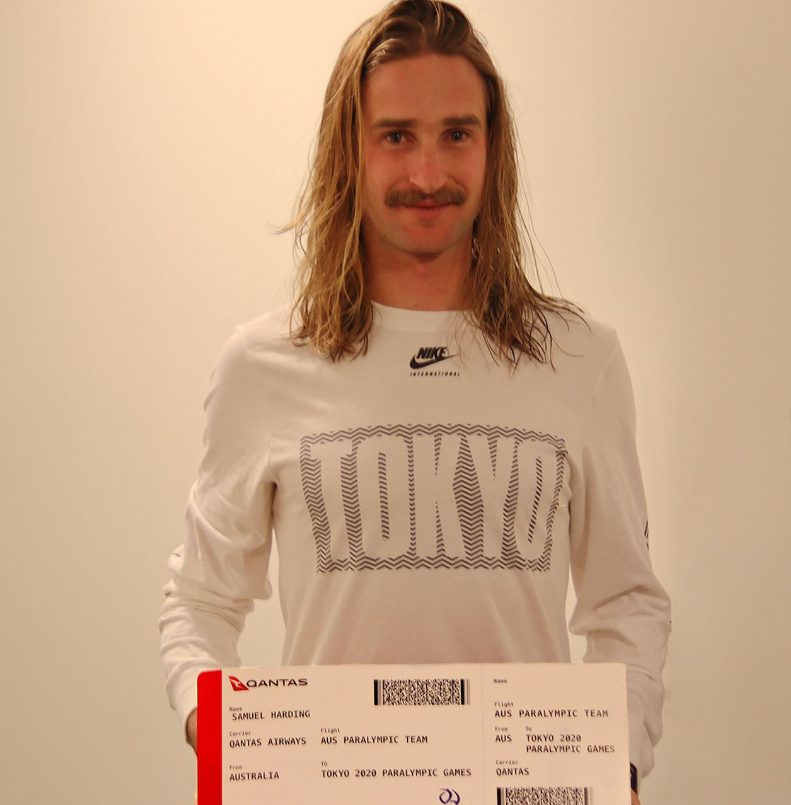 Sam Harding last year with his Tokyo Paralympics boarding pass.