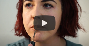 Scene from video, Brittnee applying lipstick